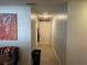 Hallway with sleek wood floors, decorative 