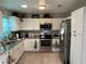 Well-equipped kitchen with stainless steel appliances and modern cabinets at 105 Byron Pl, Winter Haven, FL 33884