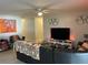 Cozy living room with modern decor, a ceiling fan, and plenty of natural light at 105 Byron Pl, Winter Haven, FL 33884