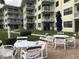 Community patio with grills and seating at 4811 Saxon # A201, New Smyrna Beach, FL 32169
