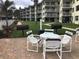 Community patio with grills and seating at 4811 Saxon # A201, New Smyrna Beach, FL 32169