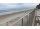 Scenic ocean view from private balcony with lounge chairs at 4811 Saxon # A201, New Smyrna Beach, FL 32169