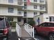 Building exterior with parking and access ramp at 4811 Saxon # A201, New Smyrna Beach, FL 32169