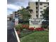 Seaward Condominiums building exterior with parking lot and landscaping at 4811 Saxon # A201, New Smyrna Beach, FL 32169