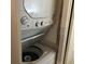 Stackable washer and dryer in convenient laundry closet at 4811 Saxon # A201, New Smyrna Beach, FL 32169