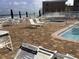 Relaxing pool area with patio furniture and ocean views at 4811 Saxon # A201, New Smyrna Beach, FL 32169