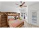 Bedroom with bunk bed, plenty of light, and pool view at 135 Marina Bay Dr # 135, New Smyrna Beach, FL 32169