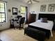A bright bedroom featuring a work area, plenty of natural light, and comfortable sleeping arrangements at 1470 Ne Old Mill Dr, Deltona, FL 32725