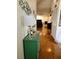 Hallway with modern decor, wood flooring, and access to the living room with a fireplace at 1470 Ne Old Mill Dr, Deltona, FL 32725