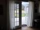 Bright patio doors lead to a screened-in deck, enhancing indoor-outdoor flow at 1470 Ne Old Mill Dr, Deltona, FL 32725