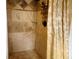 An elegant tiled shower offers a spa-like experience with modern fixtures at 1470 Ne Old Mill Dr, Deltona, FL 32725