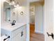 Vanity with white cabinets and a white countertop at 804 Soft Pine Ct, New Smyrna Beach, FL 32168