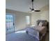 Bedroom with ceiling fan and access to backyard at 804 Soft Pine Ct, New Smyrna Beach, FL 32168