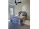 Spacious bedroom with ceiling fan and neutral decor at 804 Soft Pine Ct, New Smyrna Beach, FL 32168
