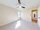Bedroom with ceiling fan and carpet flooring at 804 Soft Pine Ct, New Smyrna Beach, FL 32168