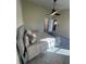 Light-filled bedroom with ceiling fan and plush bedding at 804 Soft Pine Ct, New Smyrna Beach, FL 32168