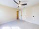 Bedroom with ceiling fan and carpet flooring at 804 Soft Pine Ct, New Smyrna Beach, FL 32168