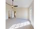 Spacious bedroom with plush carpeting and doors to other rooms at 804 Soft Pine Ct, New Smyrna Beach, FL 32168