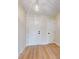 Light and airy entryway with a modern chandelier and wood floors at 804 Soft Pine Ct, New Smyrna Beach, FL 32168