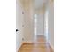 Bright hallway with light walls and wood-look flooring at 804 Soft Pine Ct, New Smyrna Beach, FL 32168