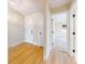Hallway with wood floors and access to rooms at 804 Soft Pine Ct, New Smyrna Beach, FL 32168