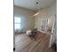 Bright home office features built-in shelving and hardwood floors at 804 Soft Pine Ct, New Smyrna Beach, FL 32168