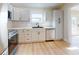 Modern kitchen with white shaker cabinets and stainless steel appliances at 804 Soft Pine Ct, New Smyrna Beach, FL 32168