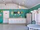 Spacious kitchen with stainless steel refrigerator, sink, and decorations at 804 Soft Pine Ct, New Smyrna Beach, FL 32168