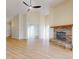 Spacious living area with a brick fireplace and high ceilings at 804 Soft Pine Ct, New Smyrna Beach, FL 32168