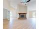 Open living room featuring a brick fireplace and ceiling fan at 804 Soft Pine Ct, New Smyrna Beach, FL 32168