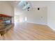 Living room with brick fireplace and vaulted ceilings at 804 Soft Pine Ct, New Smyrna Beach, FL 32168