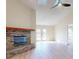 Spacious living room with brick fireplace and view to backyard at 804 Soft Pine Ct, New Smyrna Beach, FL 32168