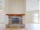 Living room with brick fireplace and light wood flooring at 804 Soft Pine Ct, New Smyrna Beach, FL 32168