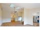 Open concept living space with skylights and wood flooring at 804 Soft Pine Ct, New Smyrna Beach, FL 32168