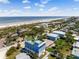 Aerial view of the property showcasing its rooftop deck with ocean views and artificial turf at 1524 N Atlantic Ave, New Smyrna Beach, FL 32169