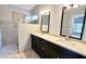 Spa-like bathroom with double vanity, quartz countertop and large shower at 806 Pine Shores Cir, New Smyrna Beach, FL 32168