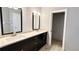 Elegant bathroom with double vanity, quartz countertop, and walk-in shower at 806 Pine Shores Cir, New Smyrna Beach, FL 32168