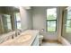 Updated bathroom with marble vanity, single sink, and shower/tub combo at 806 Pine Shores Cir, New Smyrna Beach, FL 32168