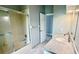 Clean bathroom with a single sink vanity, shower/tub combo, and marble countertop at 806 Pine Shores Cir, New Smyrna Beach, FL 32168