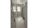 Clean bathroom with white tile and shower/tub combo at 214 S Riverside Dr, New Smyrna Beach, FL 32168