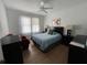 Comfortable bedroom with hardwood floors and ceiling fan at 214 S Riverside Dr, New Smyrna Beach, FL 32168