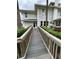 Accessible house entrance with a wooden ramp at 214 S Riverside Dr, New Smyrna Beach, FL 32168