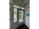 Front entry with exterior access and workshop notice at 214 S Riverside Dr, New Smyrna Beach, FL 32168