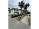 House exterior with parking and landscaped walkway at 214 S Riverside Dr, New Smyrna Beach, FL 32168
