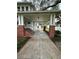Long front porch with brick pillars and a walkway at 214 S Riverside Dr, New Smyrna Beach, FL 32168