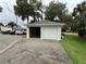 Detached garage with one open door at 214 S Riverside Dr, New Smyrna Beach, FL 32168