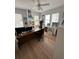 Home office with hardwood floors and large windows at 214 S Riverside Dr, New Smyrna Beach, FL 32168