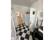 Kitchen area with refrigerator and view into a large room at 214 S Riverside Dr, New Smyrna Beach, FL 32168