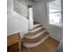 Classic wooden staircase with white railings at 214 S Riverside Dr, New Smyrna Beach, FL 32168