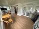 Sunroom with hardwood floors, wicker furniture, and large windows at 214 S Riverside Dr, New Smyrna Beach, FL 32168